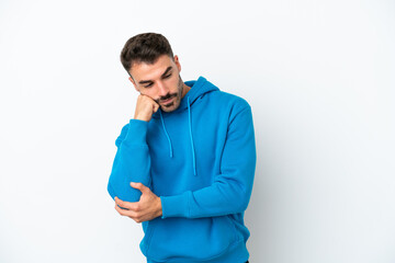 Young caucasian man isolated on white background with tired and bored expression