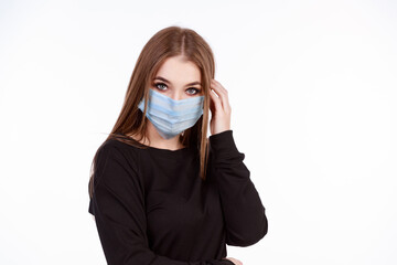 Young girl in a protective mask from the virus on a white background