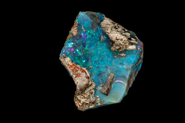 Macro stone Opal mineral in rock on a black background close up
