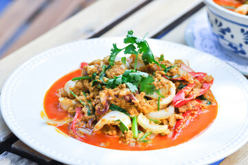   stir-fried seafood in curry powder, stir fried squid in yellow curry or Stir-fried squid and Stir-fried shrimp