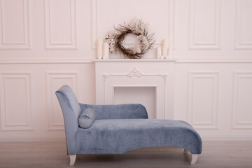 classic blue small sofa in a light room 