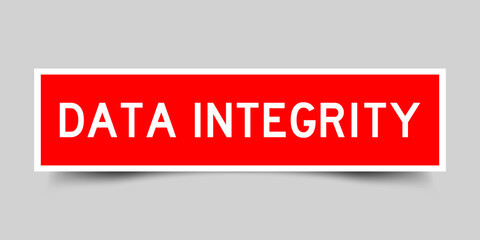 Square label sticker with word data integrity in red color on gray background