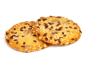 Whole grain snack cereal cookies with seeds isolated on the white background