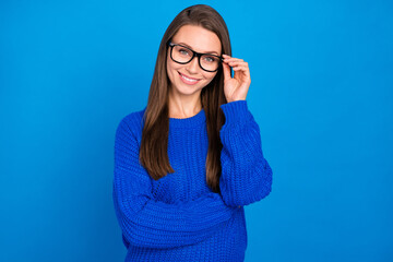 Portrait of attractive cheerful content experienced girl executive assistant touching specs isolated over bright blue color background