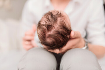 Obraz na płótnie Canvas hair. the head of a newborn