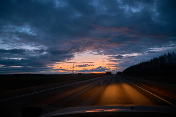 Driving on the highway at sunset