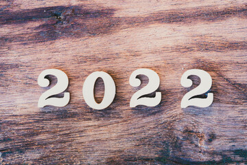 Wood Text 2022 on texture old wooden. Happy New Year concept.