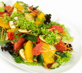 Mixed Salad with Citrus Fruits isolated on white Background