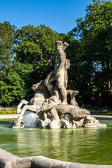 Fototapeta na wymiar The Neptune Fountain in the old Botanical Garden of Munich, Germany