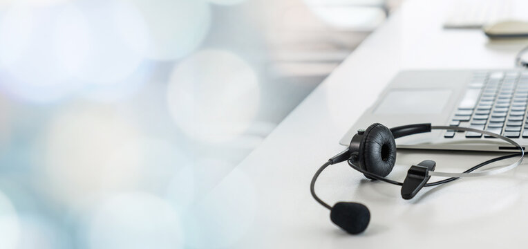 Headset and customer support equipment at call center ready for actively service . Corporate business help desk and telephone assistance concept .