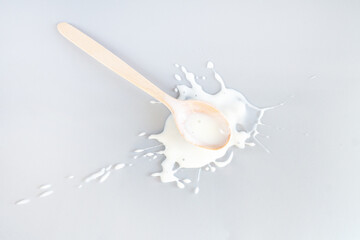 Splash and drops spill dressing with wooden spoon