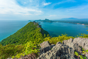 Picturesque view of Andaman sea in Phuket island, Thailand. View through the jungle on the beautiful bay and mountains. Tropical beach Laem Singh