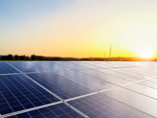 solar panels on the roof with the sunset background.