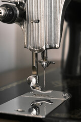 Antique sewing machine. Old sewing machine details. Vintage tailor sewing machine.