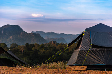 Camping tent with mountain background in holiday