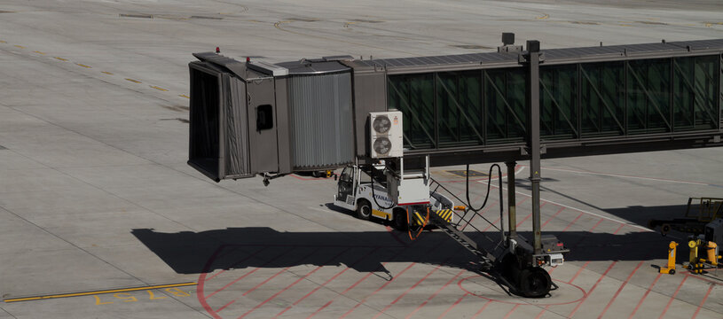 Passenger Boarding Bridge (PBB, Jetway, Air, Jet, or Sky Bridge) at John Paul II Krak&oacute;w-Balice International Airport on September 11, 2021 in Balice, Poland.