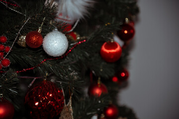 bright Christmas toys on the Christmas tree 