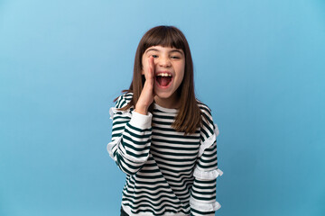 Little girl over isolated background shouting with mouth wide open