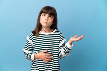 Fototapeta premium Little girl over isolated background having doubts