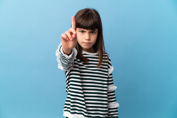Fototapeta premium Little girl over isolated background counting one with serious expression