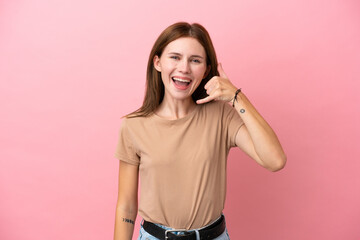 Obraz na płótnie Canvas Young English woman isolated on pink background making phone gesture. Call me back sign