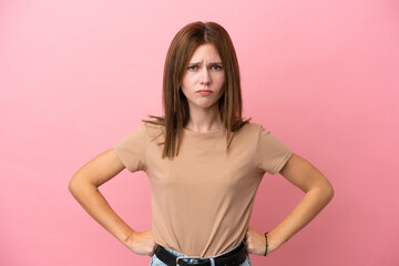 Young English woman isolated on pink background angry