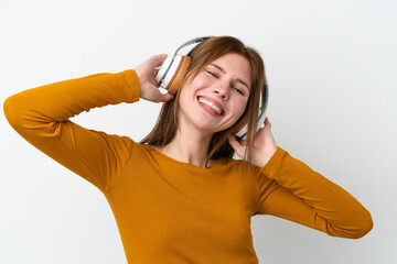 Young English woman isolated on white background listening music