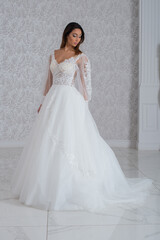Fototapeta premium Girl with wedding dress posing for photo shoot