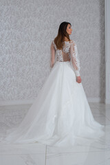 Fototapeta premium Girl with wedding dress posing for photo shoot