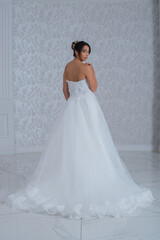 Fototapeta premium Girl with wedding dress posing for photo shoot