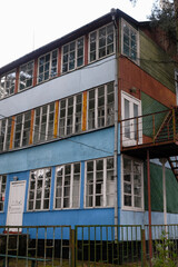 Obraz premium Lake Svityaz, Volyn Region, Ukraine. August 29, 2021. Shatsky national natural park. Colored wooden cottage on the lake coast from the Soviet past. A place of summer rest for Soviet people. 