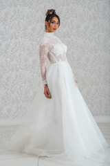 Fototapeta premium Girl with wedding dress posing for photo shoot