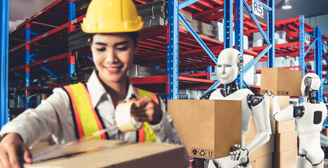 Innovative industry robot working in warehouse together with human worker . Concept of artificial...