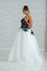 Fototapeta premium Girl with wedding dress posing for photo shoot