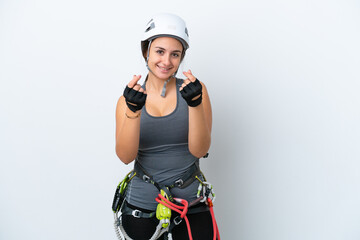 Young Ukrainian rock climber woman isolated on white background making money gesture