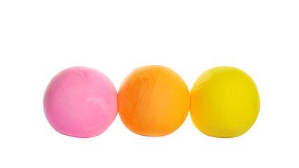 Row of color play dough balls isolated on white