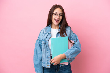 Young Ukrainian student woman isolated on pink background with surprise facial expression