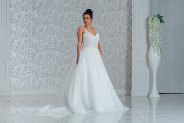Fototapeta premium Girl with wedding dress posing for photo shoot