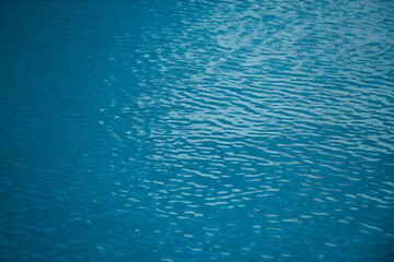 Background of water, surface blue swimming pool.