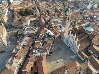 Fototapeta premium Aerial view of facade of the ancient Duomo in Monza (Monza Cathedral). Drone photography of the main square with church in Monza in north Italy, Brianza, Lombardia, near Milan.