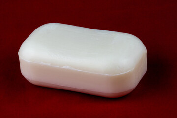 Single Bar of Hand Soap Isolated Against a Red Background