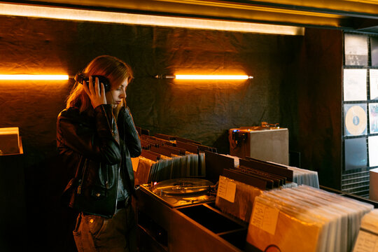 Woman playing record player