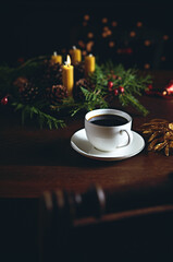 Cu of of black coffee and Advent wreath on an old wooden table - 471514322