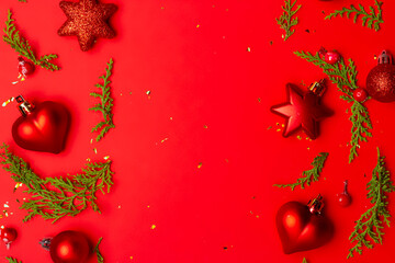 Christmas composition with decorations and ornametns on red background