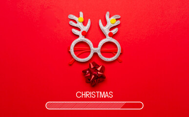 Composition with the design of Christmas loading on a red background