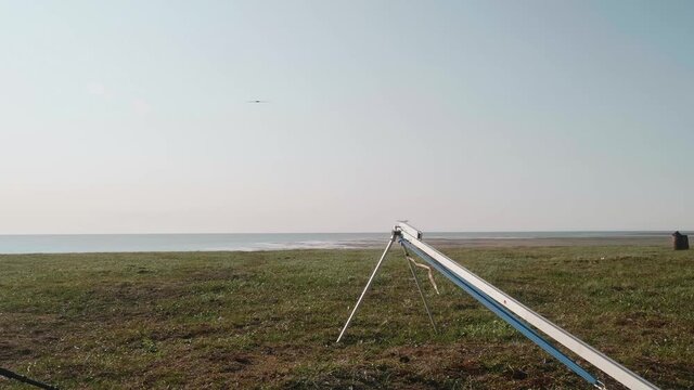 Drone starting its flight in the sky. Amazing sunset in the middle of Tundra in Russia