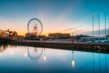 Obraz premium Helsinki, Finland. View Of Embankment With Ferris Wheel In Sunrise Morning