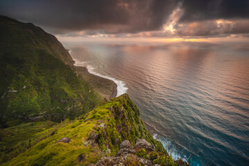 The green coast of Madeira over the Atlantic Ocean photographed in spring.
