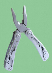 Miniature, pocket-sized universal Multi tool containing  knife, opener, pliers, scissors and a file.