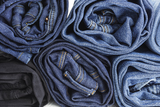 Heap of blue jeans in studio